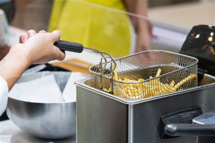 How do you get stuck grease out of a deep fryer?