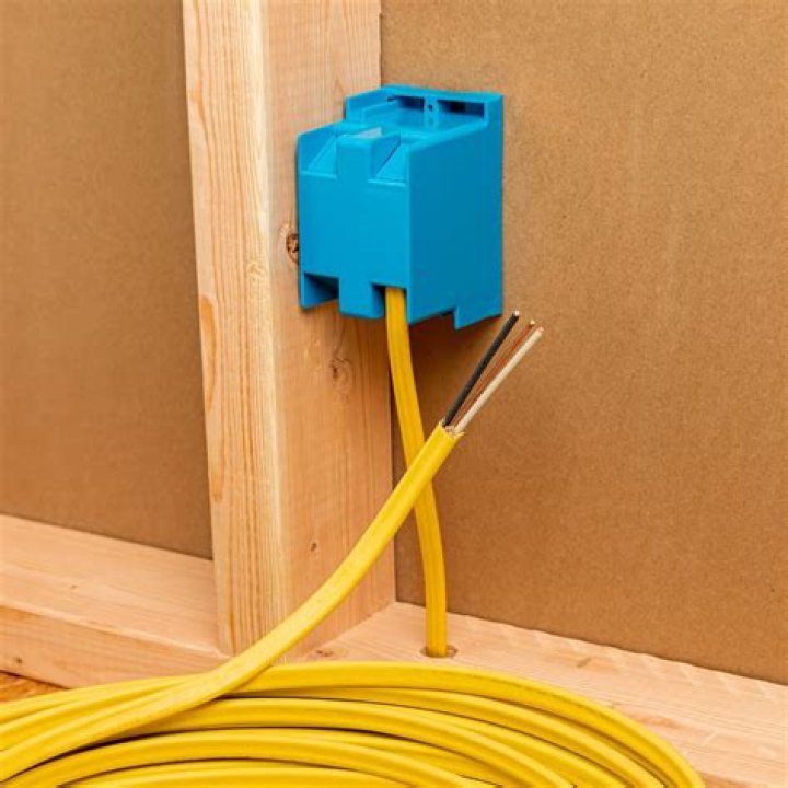 How far from a box must Romex be secured?