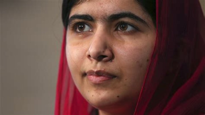 How long was Malala in a coma?