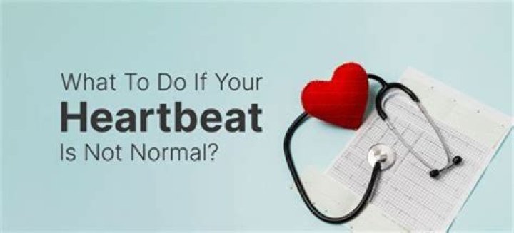 Why do I feel my heartbeat in my throat when I lay down?